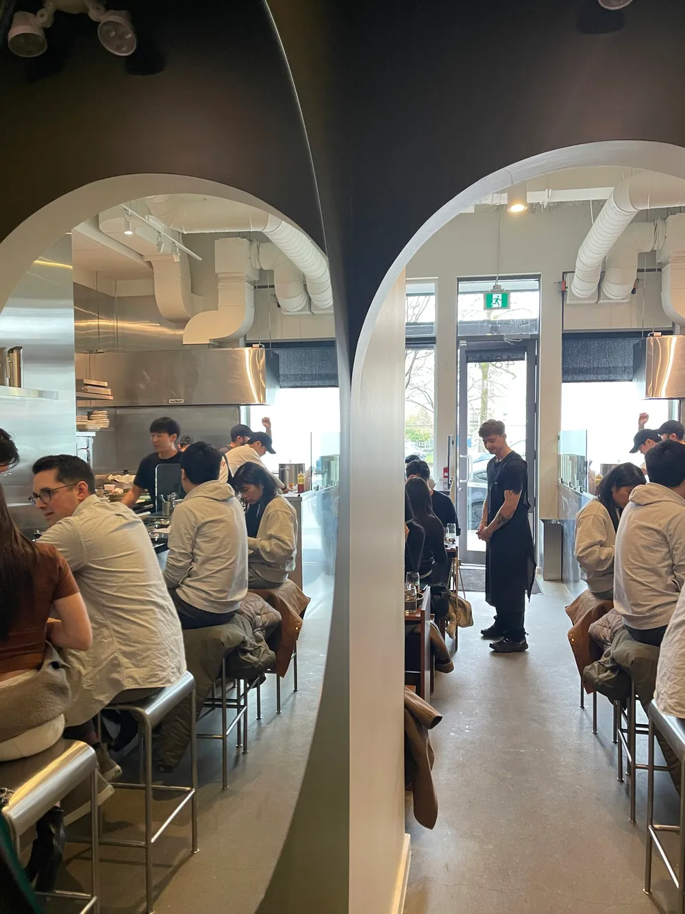 The Nui dining room with the red Nui logo on the wall